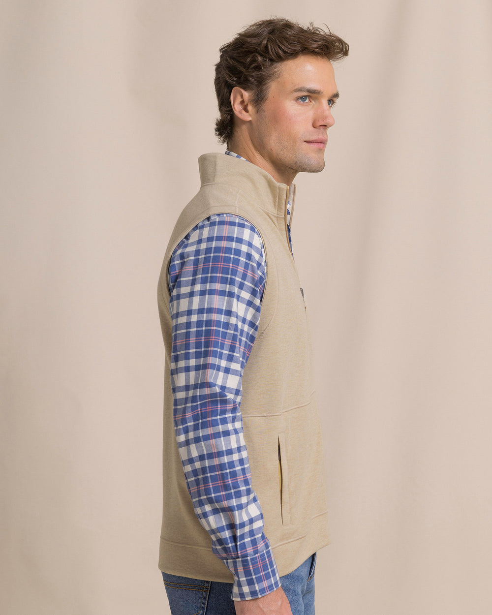 The side view of the Southern Tide Lightweight Knit Heather Reversible Vest by Southern Tide - Heather Sandstone Khaki