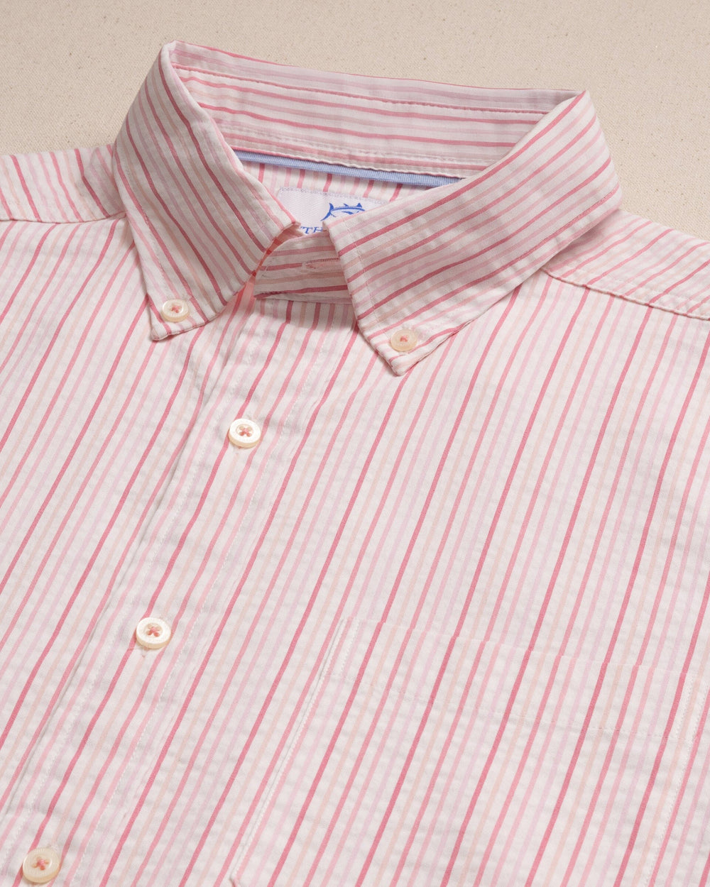 The detail view of the Southern Tide Marina Seersucker Coastal Breeze® Short Sleeve Sport Shirt by Southern Tide - Sea Pink