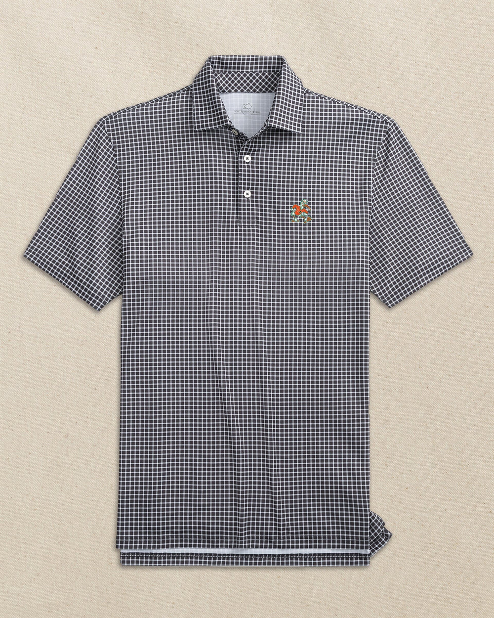 The front view of the Southern Tide Miami Sebastian the Ibis Driver Dunes Edge Plaid Polo by Southern Tide - Black
