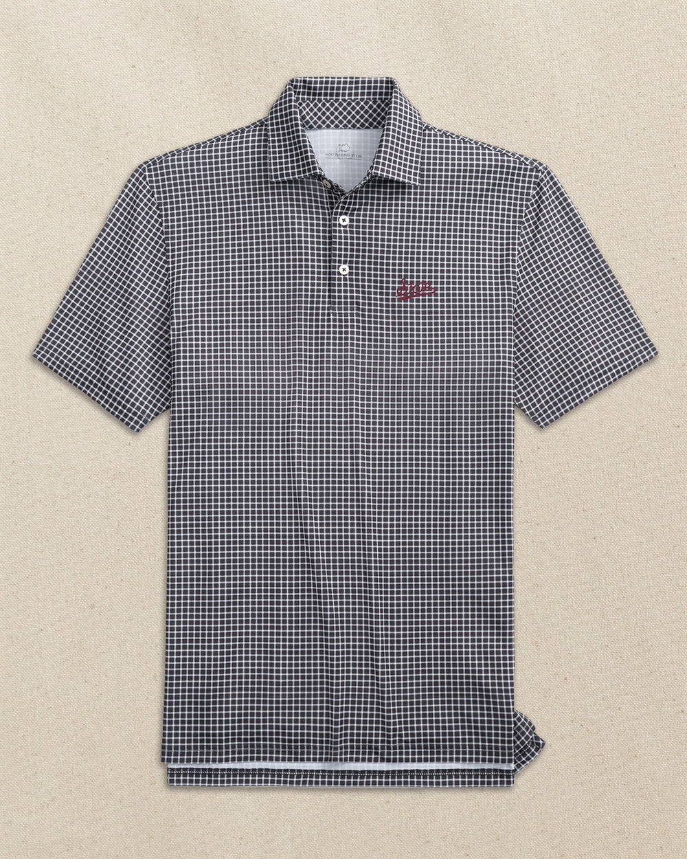 The front view of the Southern Tide Mississippi State Script Driver Dunes Edge Plaid Polo by Southern Tide - Black