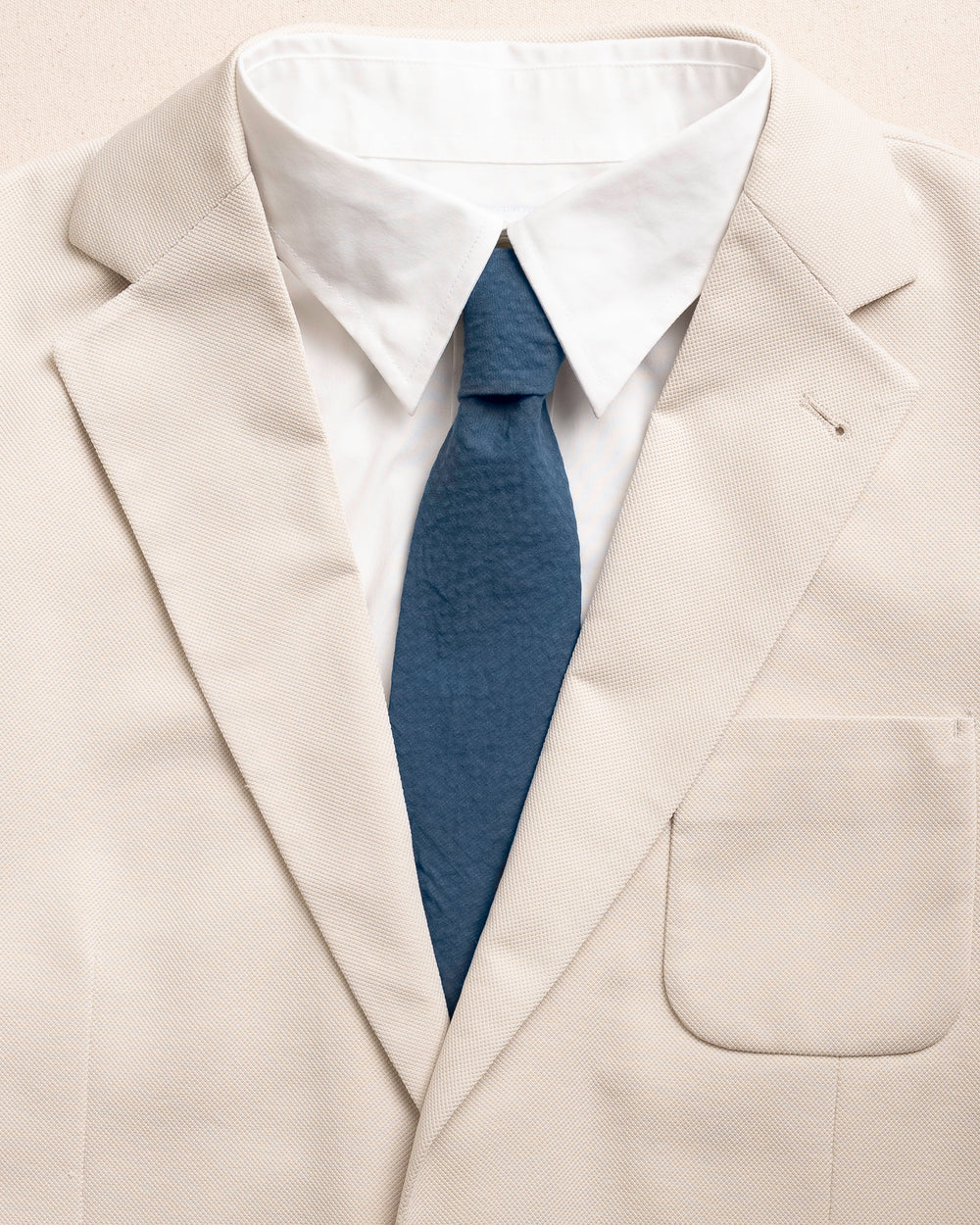 The detail coat view of the Southern Tide Nautical Blue Seersucker Necktie by Southern Tide - Nautical Blue
