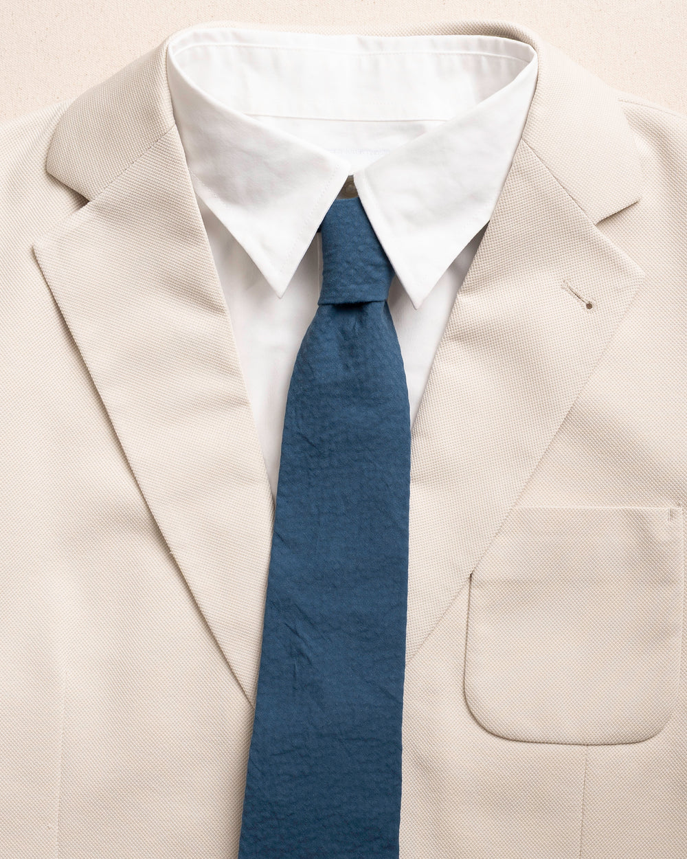 The detail coat view of the Southern Tide Nautical Blue Seersucker Necktie by Southern Tide - Nautical Blue