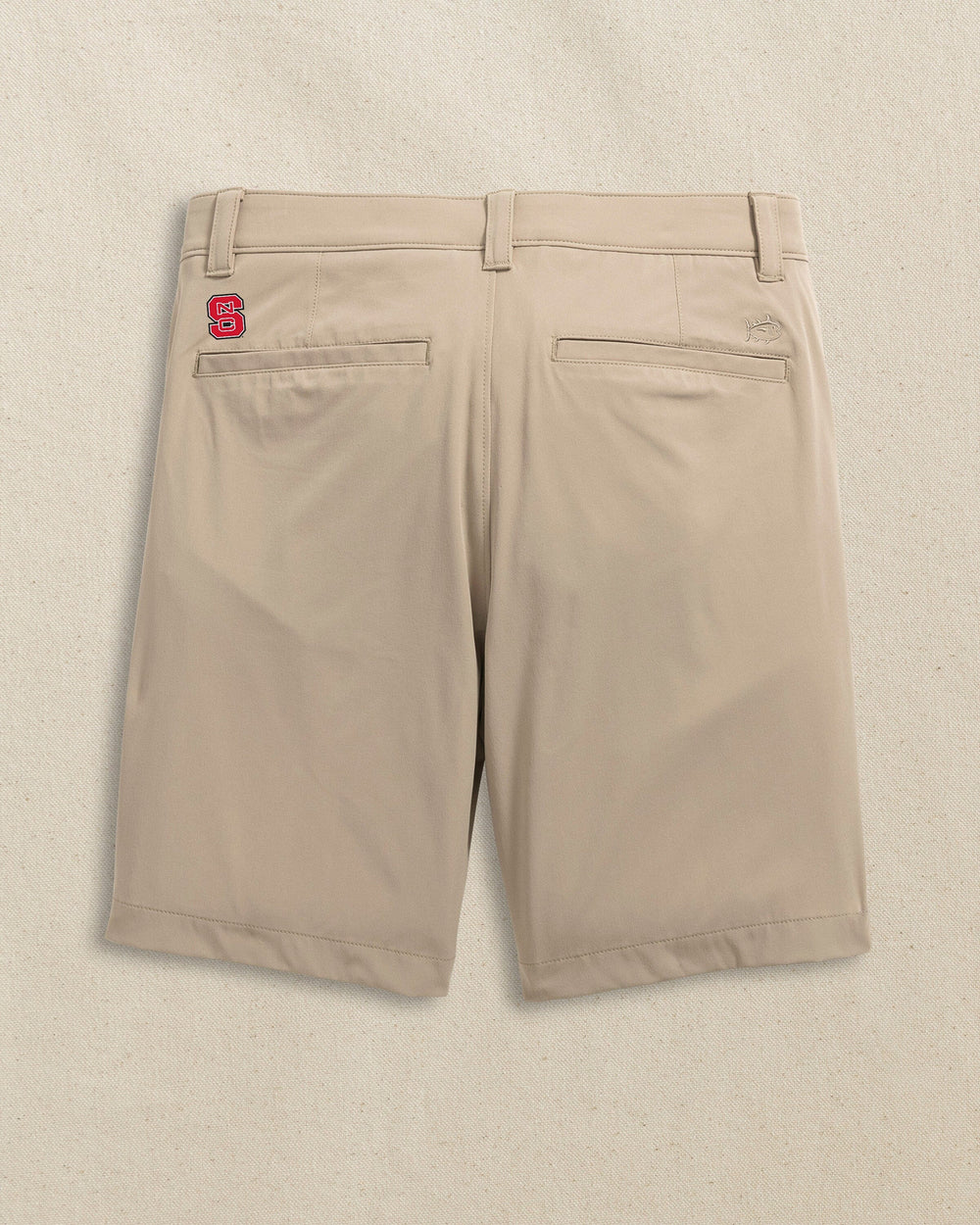 The back view of the Southern Tide NC State Wolfpack brrr°®-die 8" Performance Short by Southern Tide - Sandstone Khaki