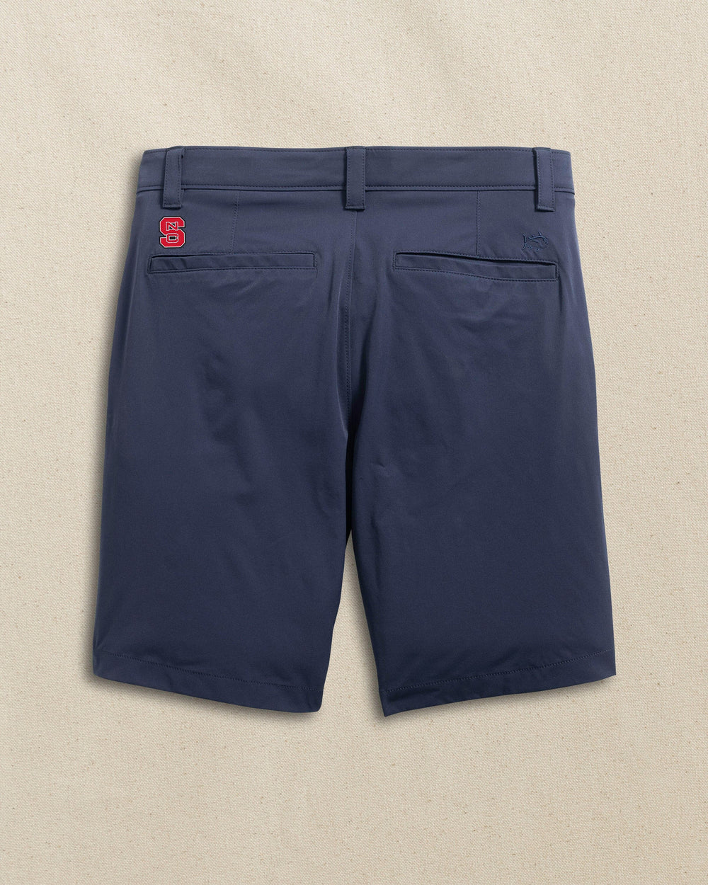The back view of the Southern Tide NC State Wolfpack brrr°®-die 8" Performance Short by Southern Tide - True Navy