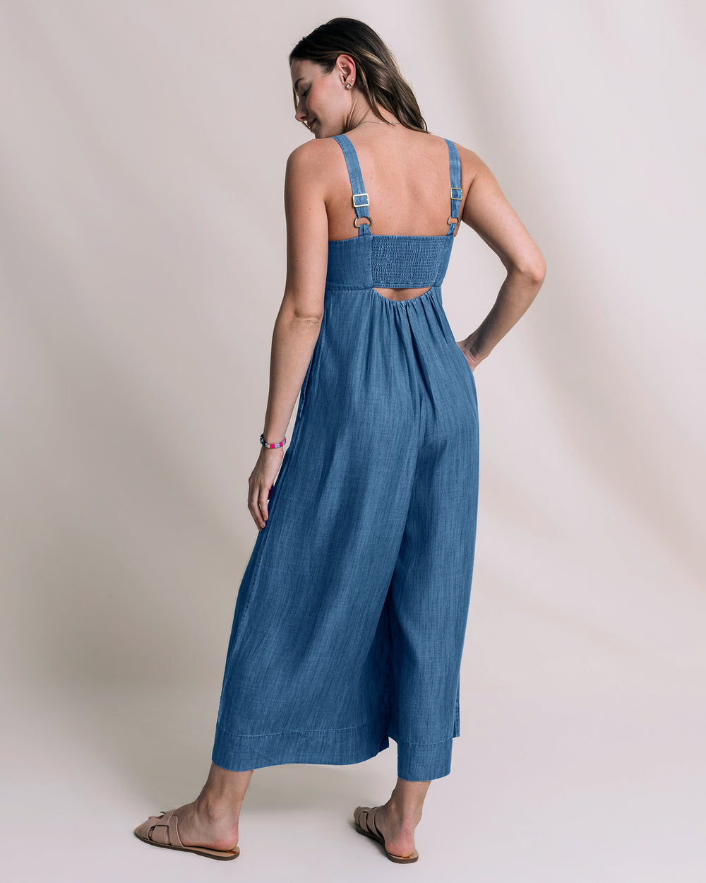The back view of the Southern Tide Nina Denim Jumpsuit by Southern Tide - Medium Wash Indigo