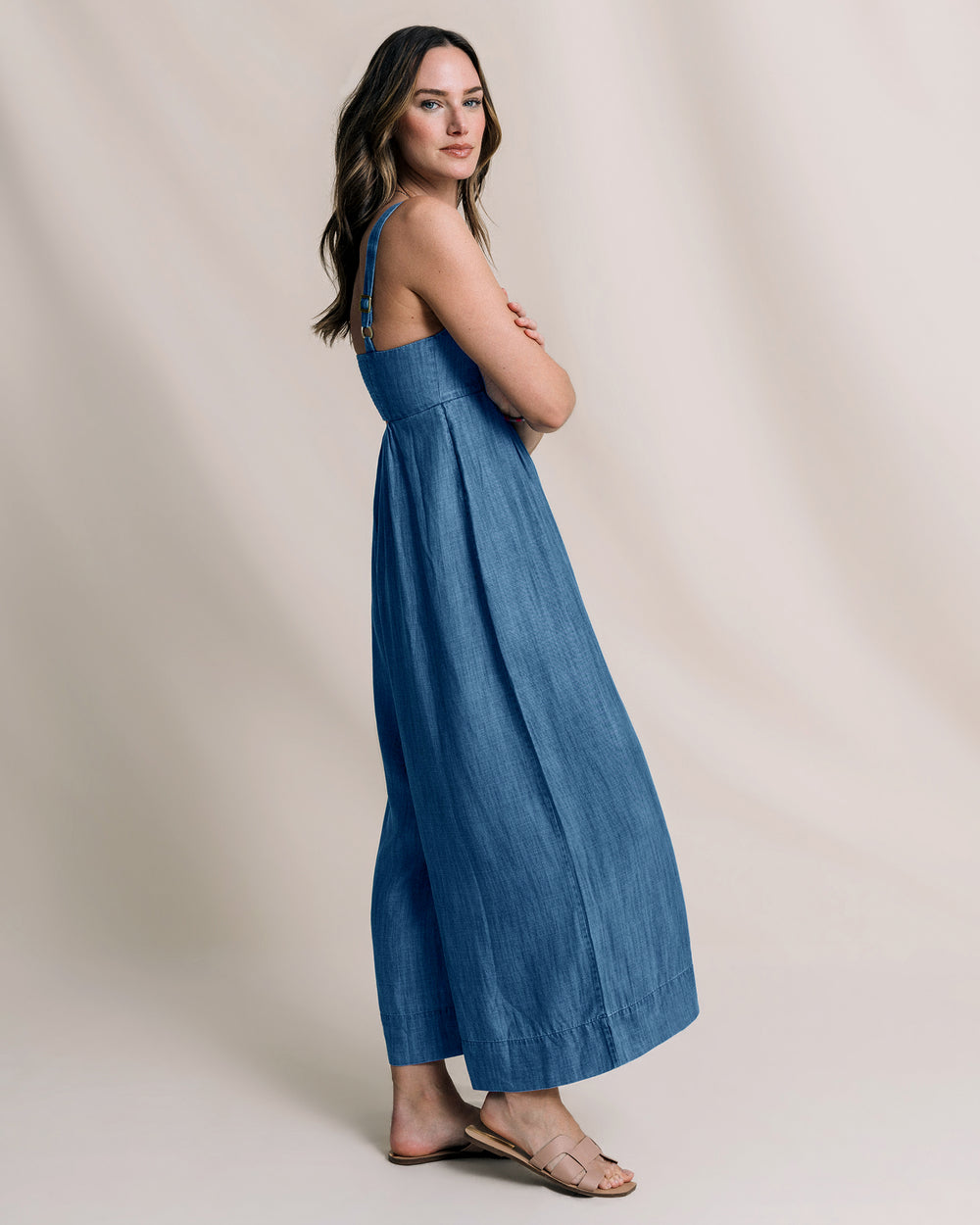 The side view of the Southern Tide Nina Denim Jumpsuit by Southern Tide - Medium Wash Indigo