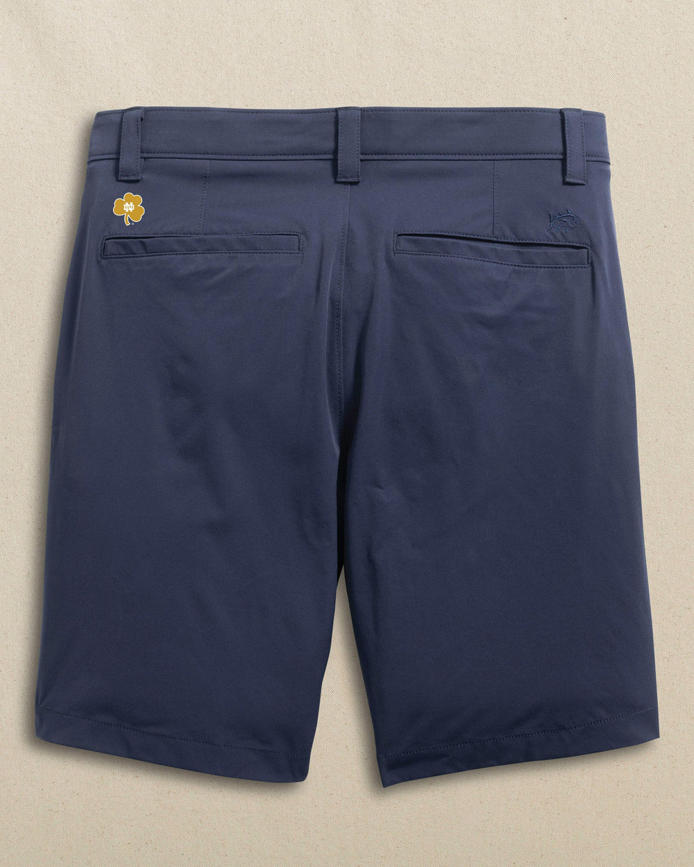 The back view of the Southern Tide Notre Dame Fighting Irish brrr°®-die 8" Performance Short by Southern Tide - True Navy