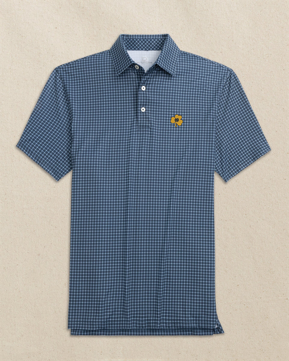 The front view of the Southern Tide Notre Dame Shamrock Driver Dunes Edge Plaid Polo by Southern Tide - Navy