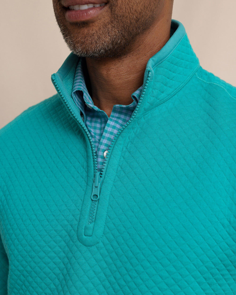 The detail view of the Southern Tide Oak Island Reversible Quarter Zip by Southern Tide - Spruce Shade