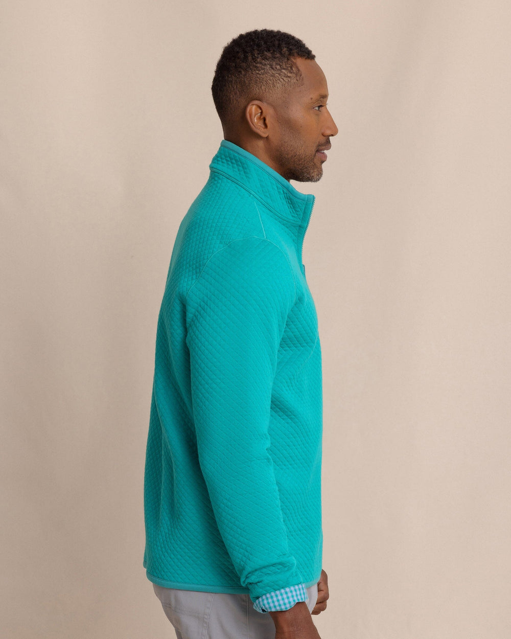 The side view of the Southern Tide Oak Island Reversible Quarter Zip by Southern Tide - Spruce Shade