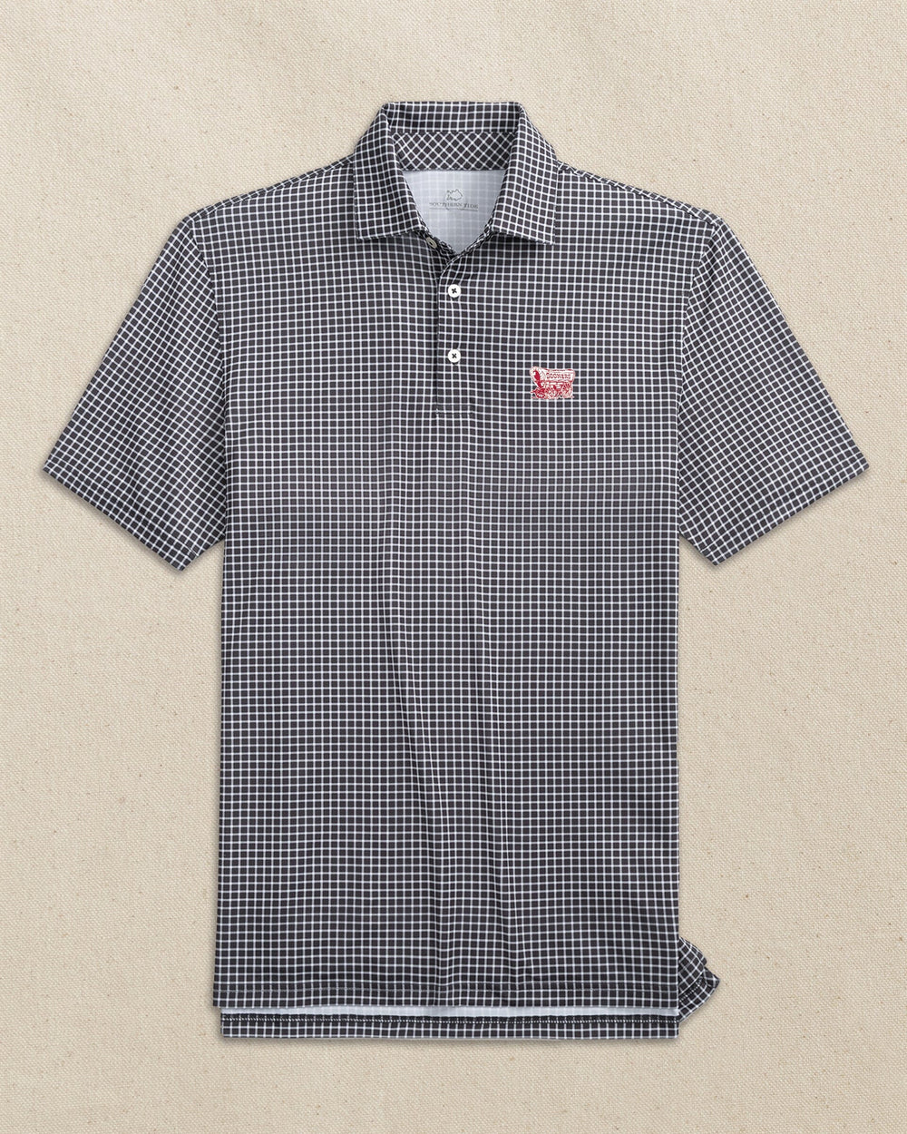 The front view of the Southern Tide Oklahoma Sooner Schooner Driver Dunes Edge Plaid Polo by Southern Tide - Black