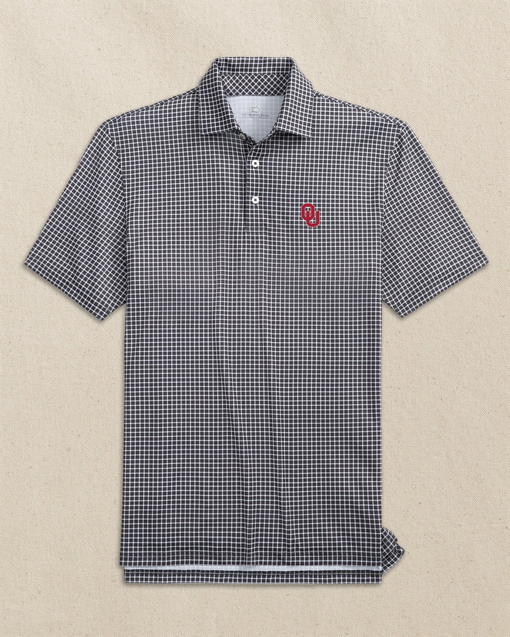 The front view of the Southern Tide Oklahoma Sooners Driver Dunes Edge Plaid Polo by Southern Tide - Black