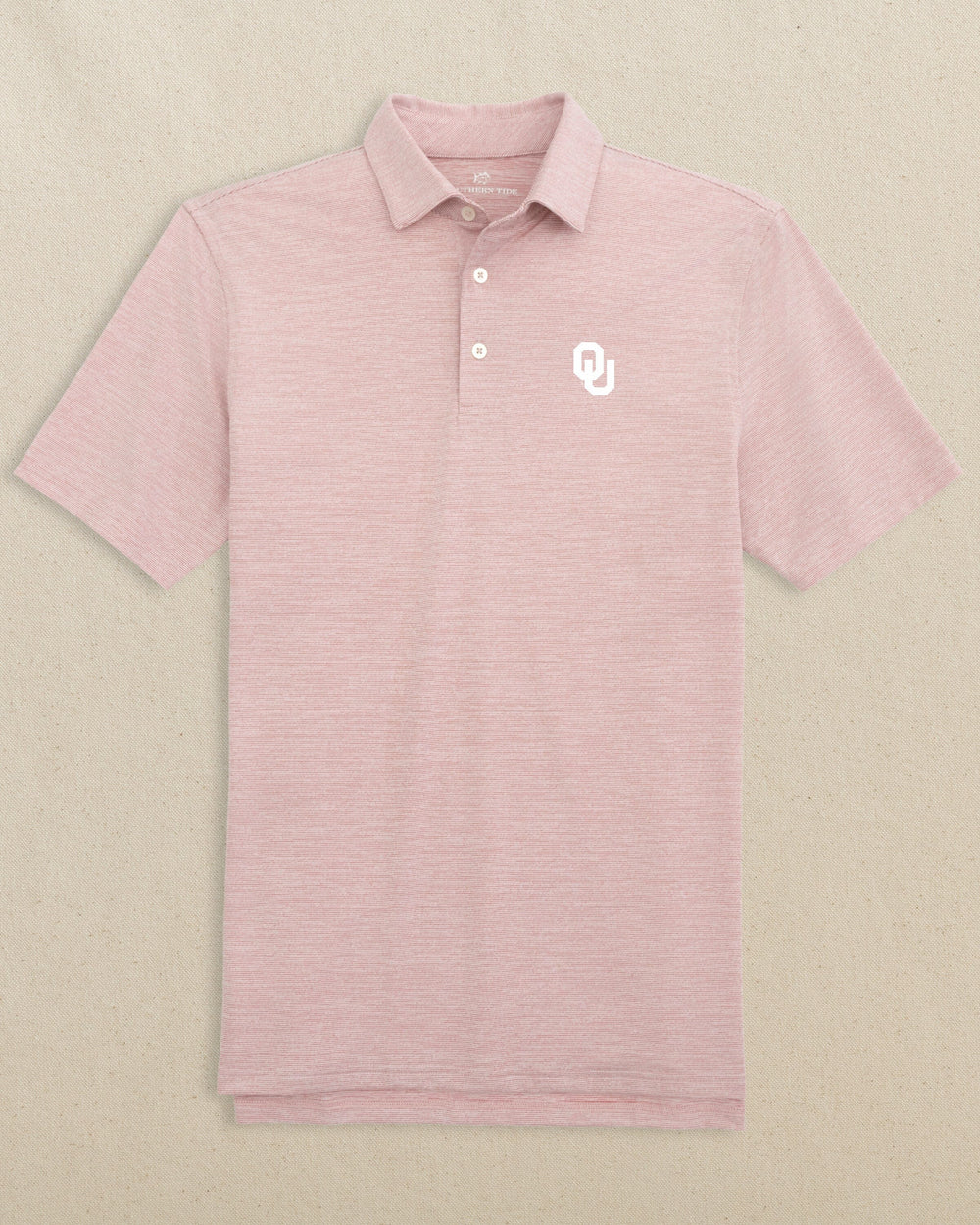 The front view of the Southern Tide Oklahoma Sooners White Logo Driver Spacedye Polo Shirt by Southern Tide - Crimson