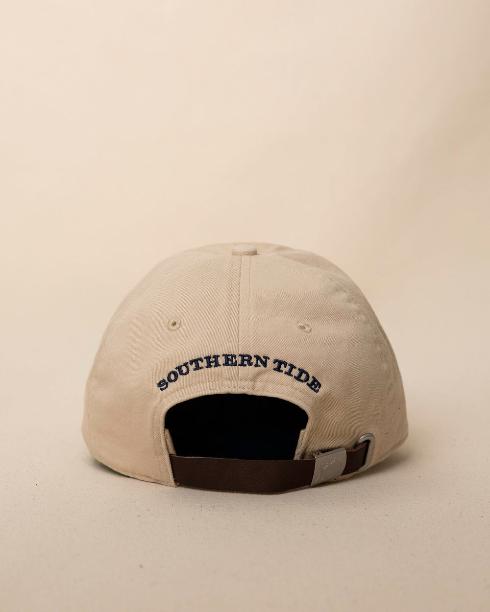 The back view of the Southern Tide Outline Skipjack Leather Strap Hat by Southern Tide - Sand Dune