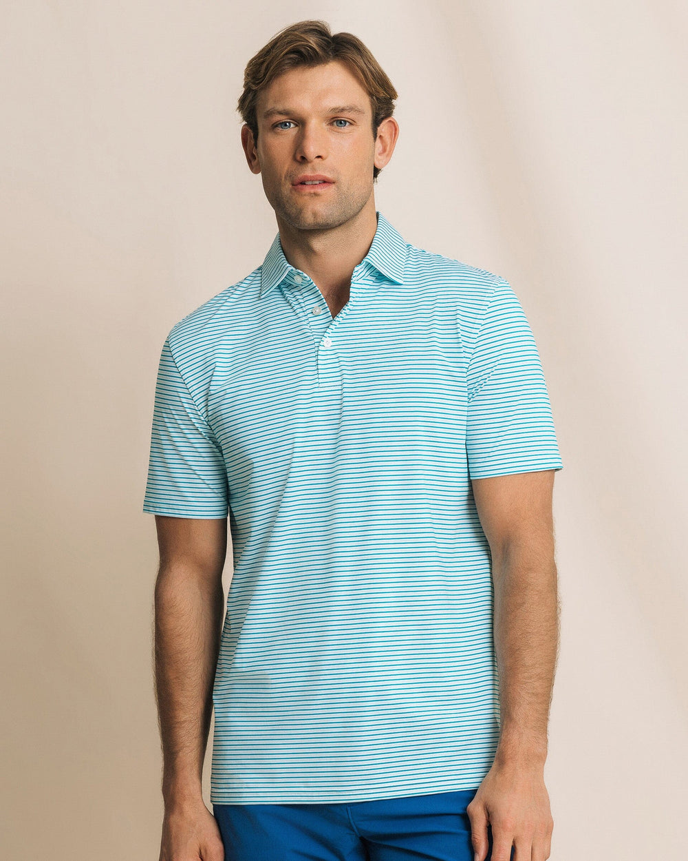The front view of the Southern Tide Pelican Landing Stripe Coastal Breeze® Performance Polo by Southern Tide - Teal Depths
