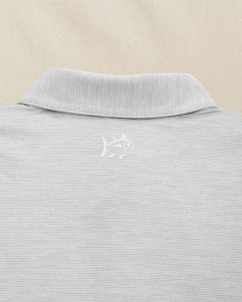 The detail view of the Southern Tide Penn State Nittany Lions Driver Spacedye Polo by Southern Tide - Slate Grey