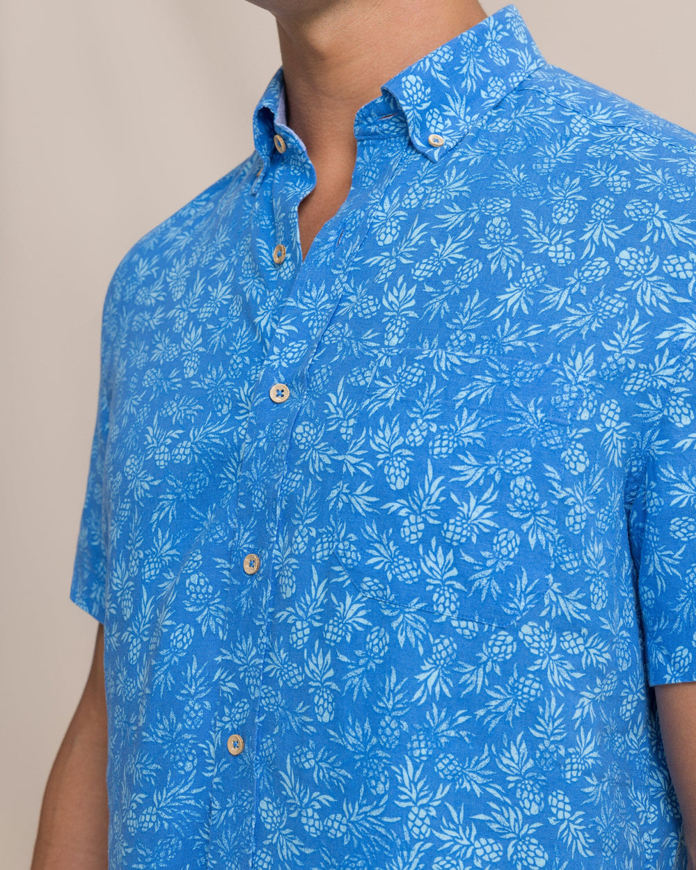 The detail view of the Southern Tide Pineapple Parade Linen Rayon Short Sleeve Sport Shirt by Southern Tide - Blue Stream