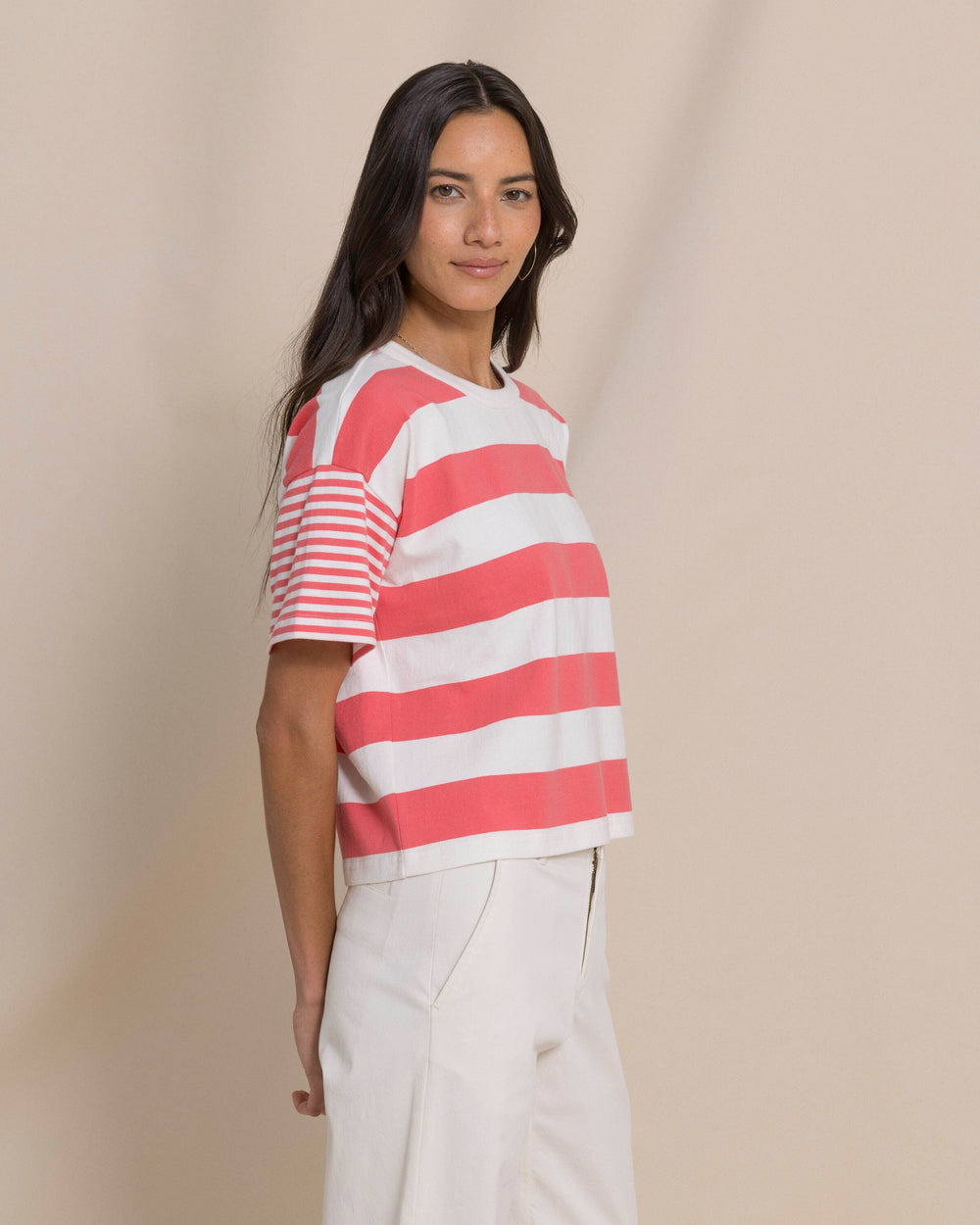 The side view of the Southern Tide Remi Mixed Stripe Boxy Tee by Southern Tide - Coral Beach