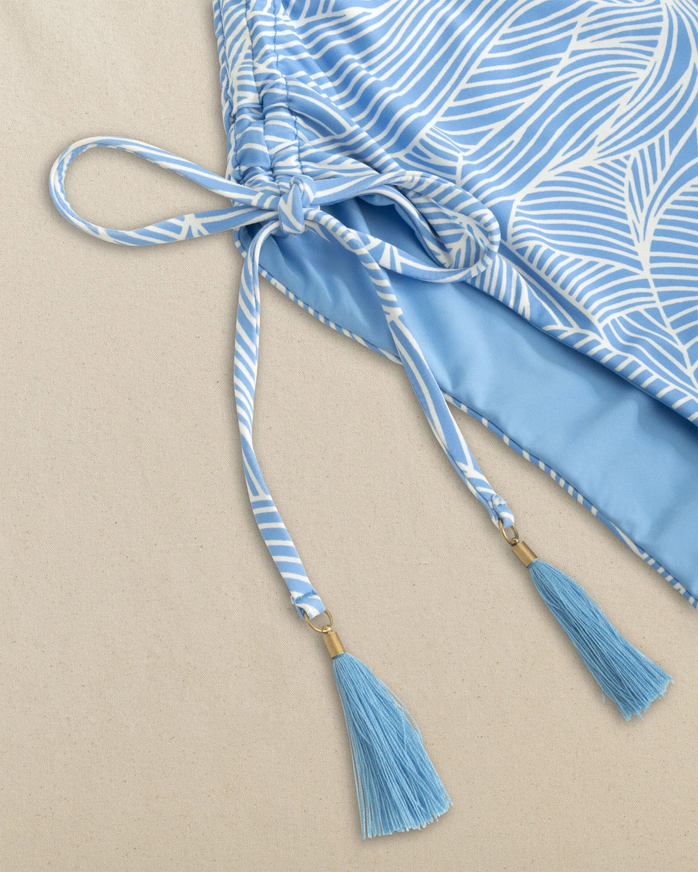 The detail view of the Southern Tide Reversible Bandeau One-Piece Swimsuit by Southern Tide - Ocean Channel