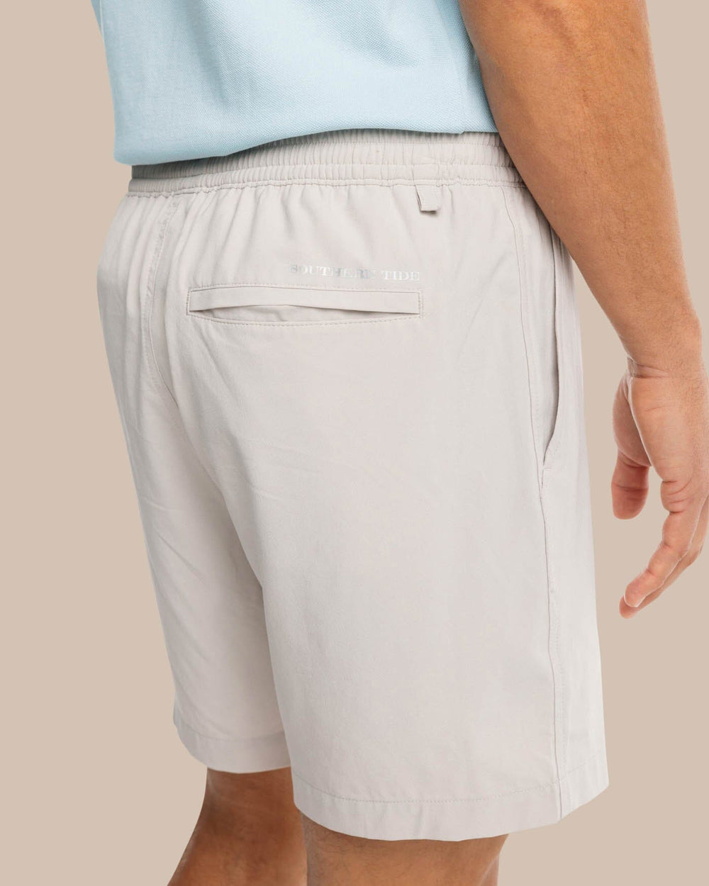 The model pocket view of the Men's Rip Channel 6 Inch Performance Short by Southern Tide - Marble Grey