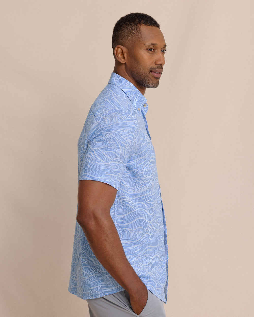 The side view of the Southern Tide Rolling Waves Linen Rayon Short Sleeve Sport Shirt by Southern Tide - Cerulean
