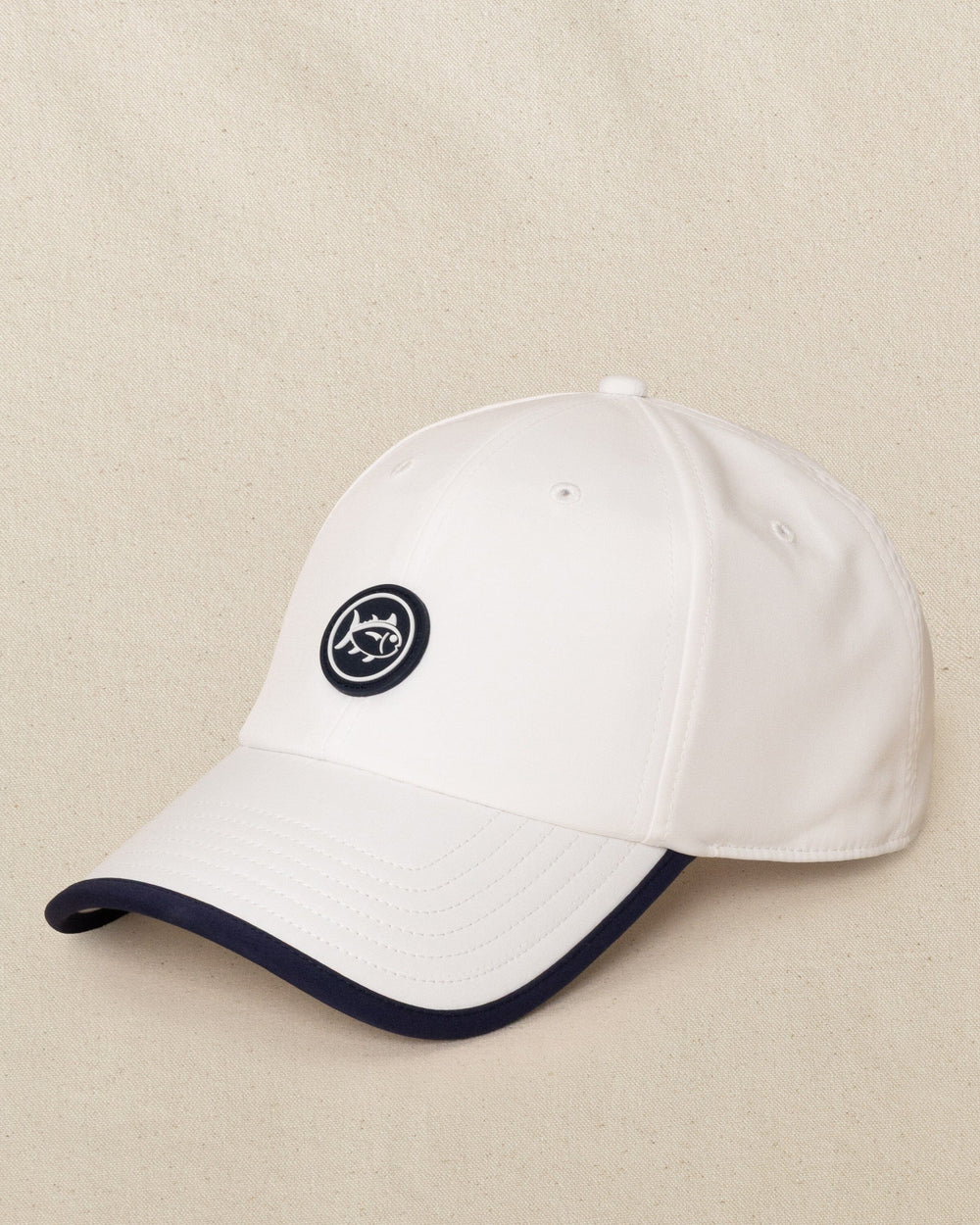 The side view of the Southern Tide Rubber Skipjack Patch Performance Hat by Southern Tide - White