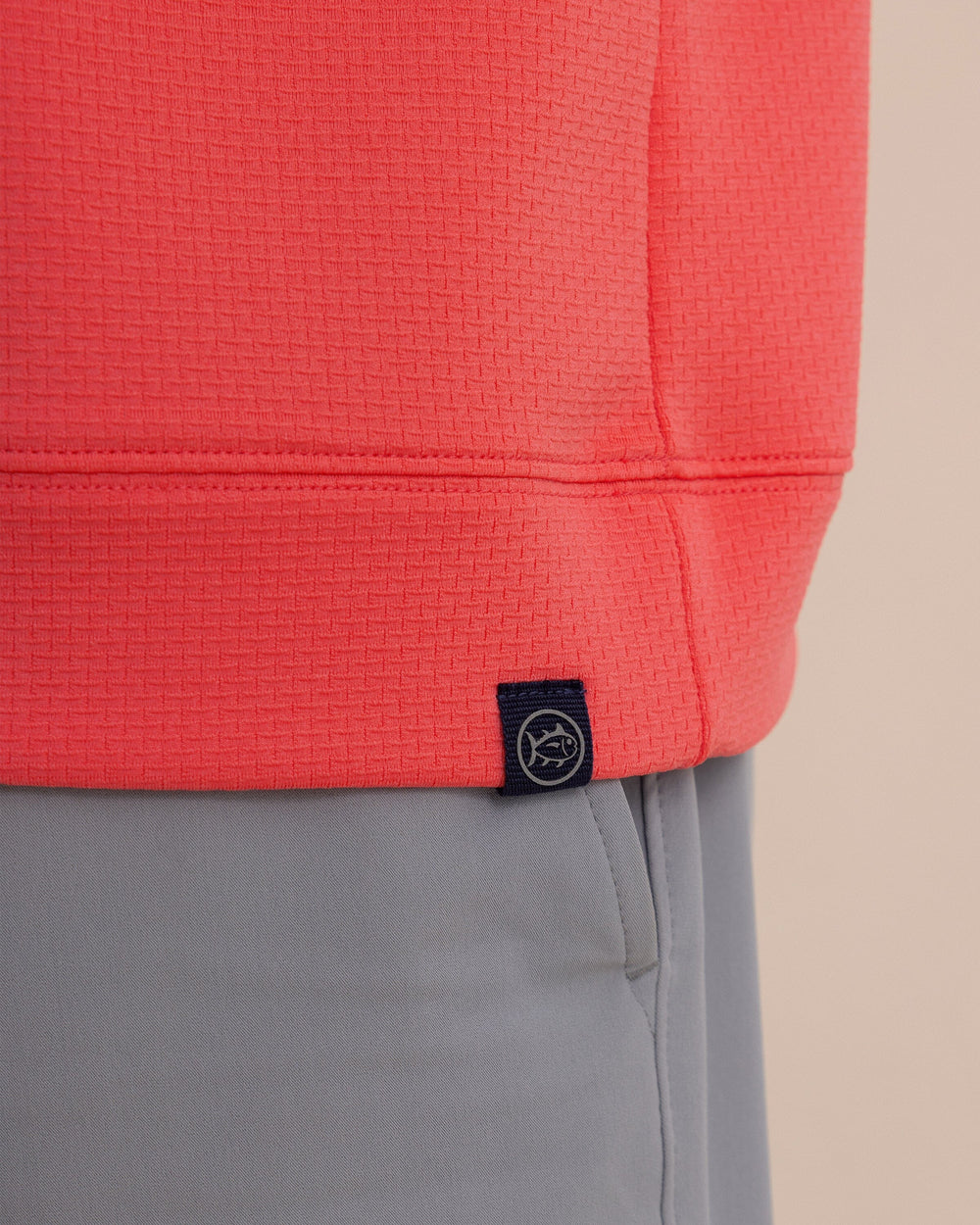 The detail view of the Southern Tide Schooner Quarter Zip by Southern Tide - Sunkist Coral
