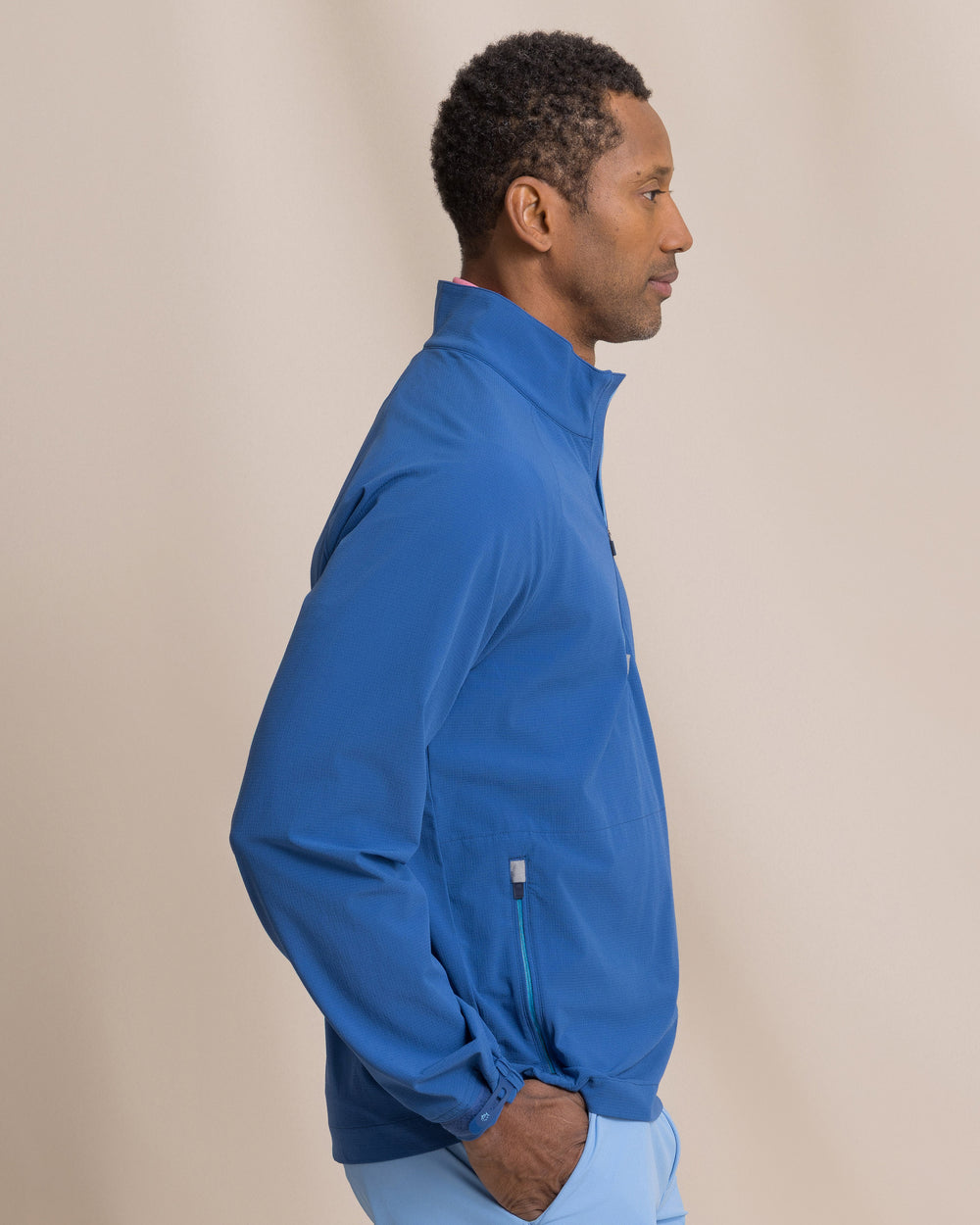 The side view of the Southern Tide Seabreeze Performance Pullover by Southern Tide - Nautical Blue