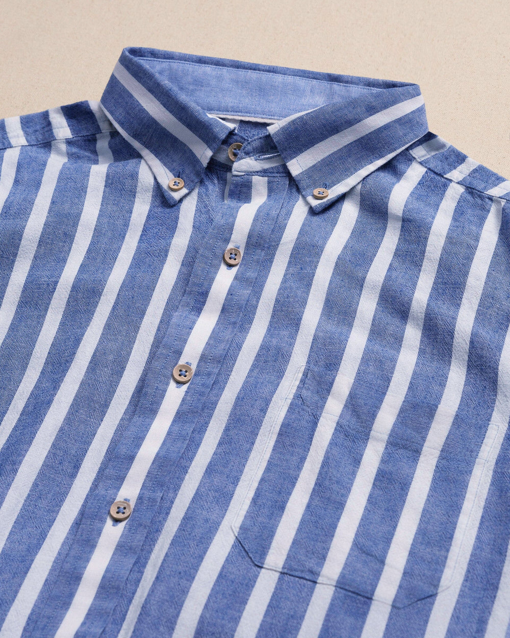 The detail view of the Southern Tide Seamark Stripe Linen Rayon Short Sleeve Sport Shirt by Southern Tide - Nautical Blue