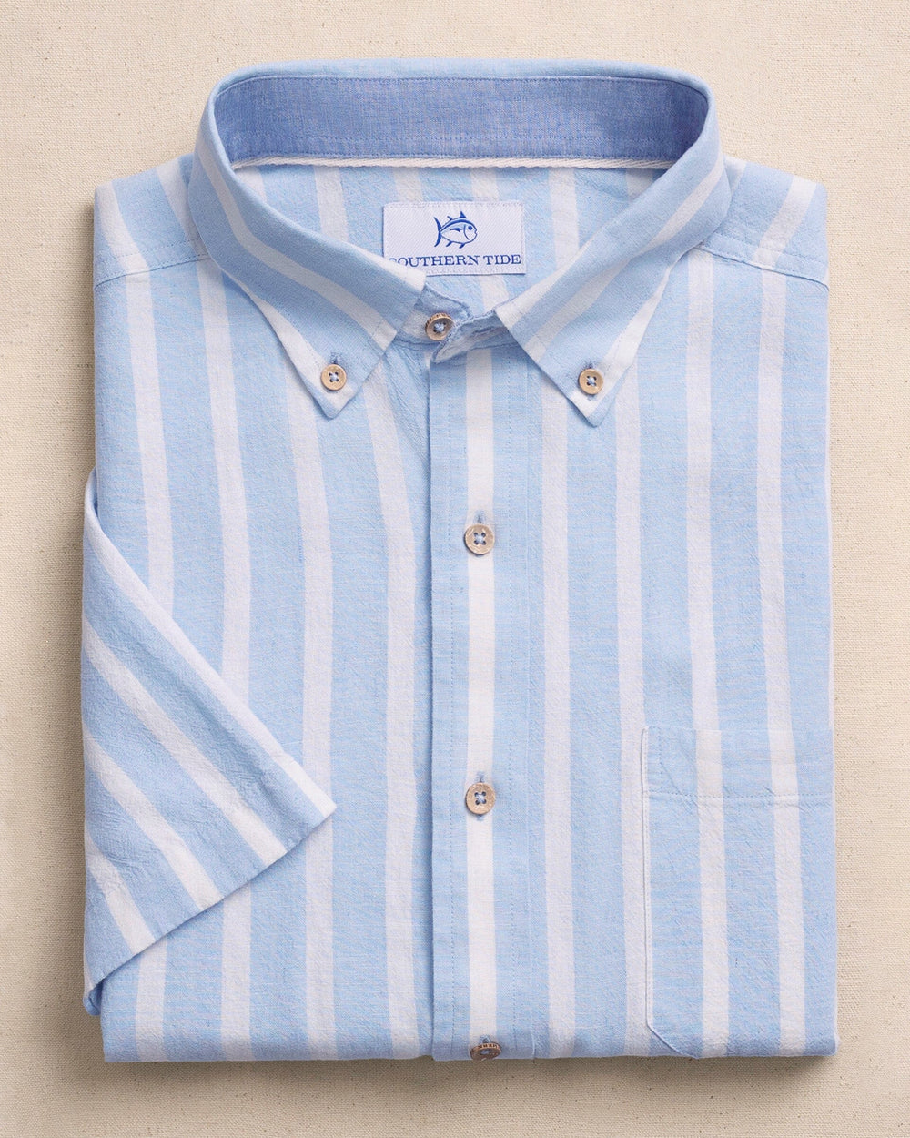 The front view of the Southern Tide Seamark Stripe Linen Rayon Short Sleeve Sport Shirt by Southern Tide - Tide Blue
