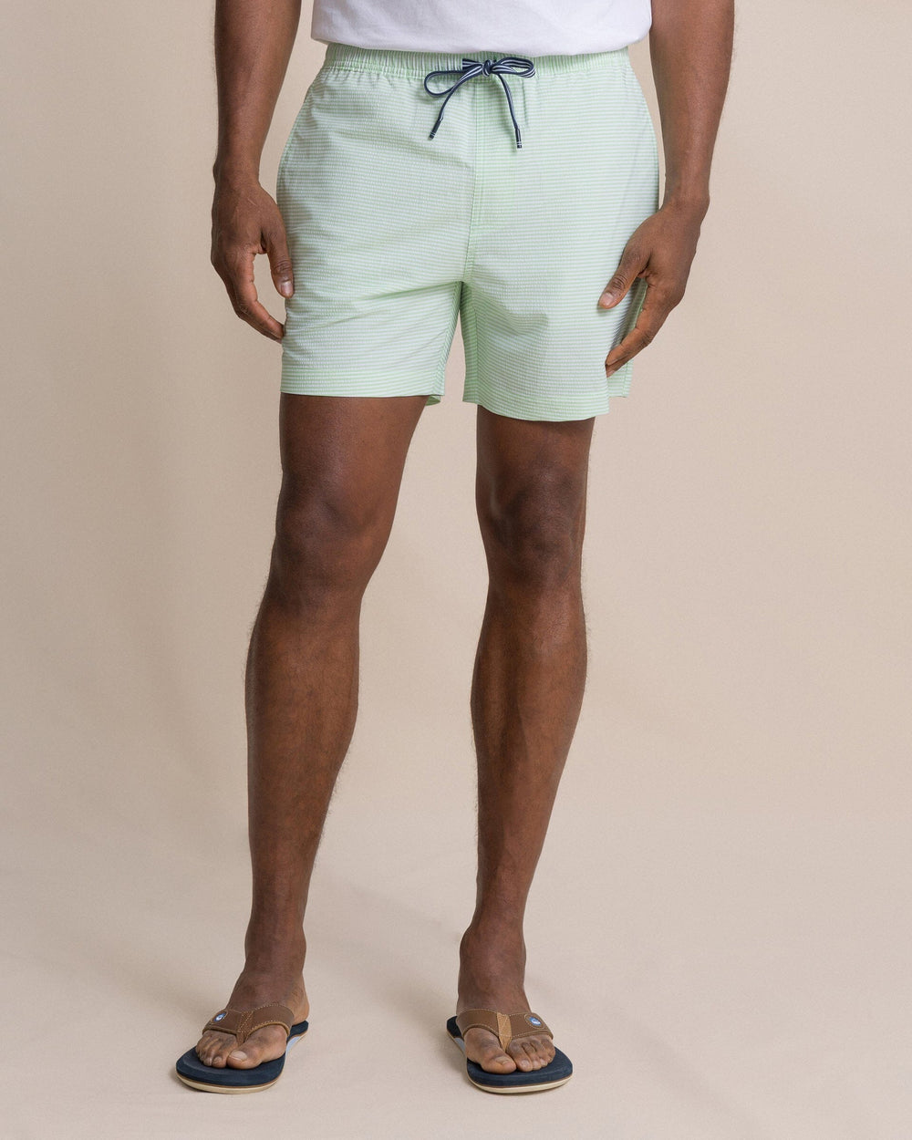 The front view of the Southern Tide Seersucker Stripe Maritime Swim Trunk by Southern Tide - Green Ash
