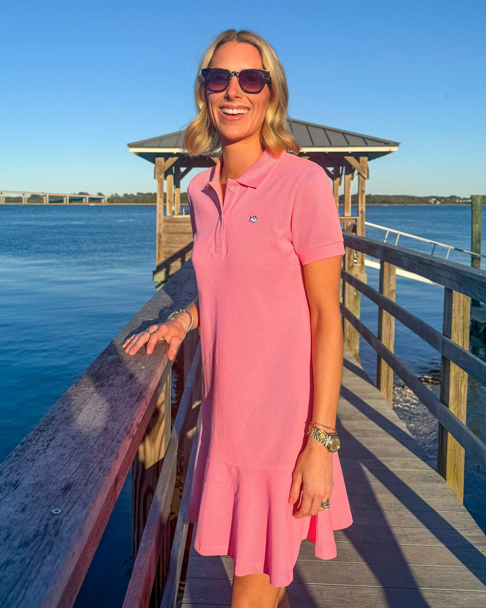 The lifestyle view of the Southern Tide Skipjack Dropwaist Polo Dress by Southern Tide - Sea Pink
