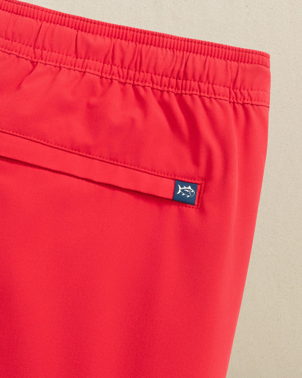 The detail view of the Southern Tide Solid Maritime Swim Trunk by Southern Tide - Channel Marker Red