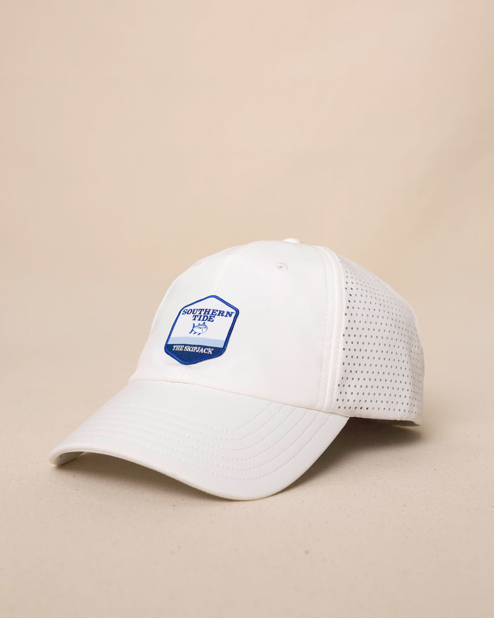 The side view of the Southern Tide Southern Tide Badge Performance Trucker Hat by Southern Tide - White