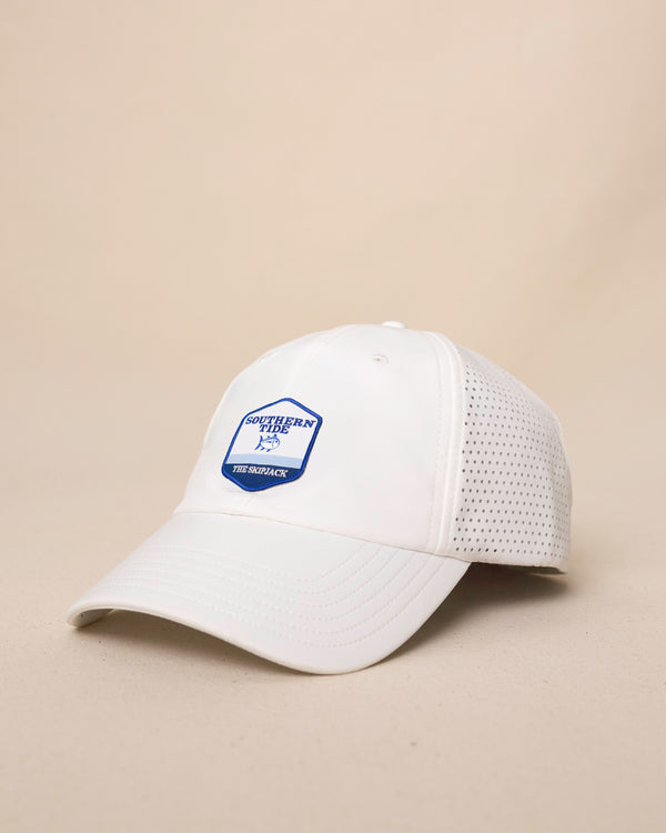 The side view of the Southern Tide Southern Tide Badge Performance Trucker Hat by Southern Tide - White