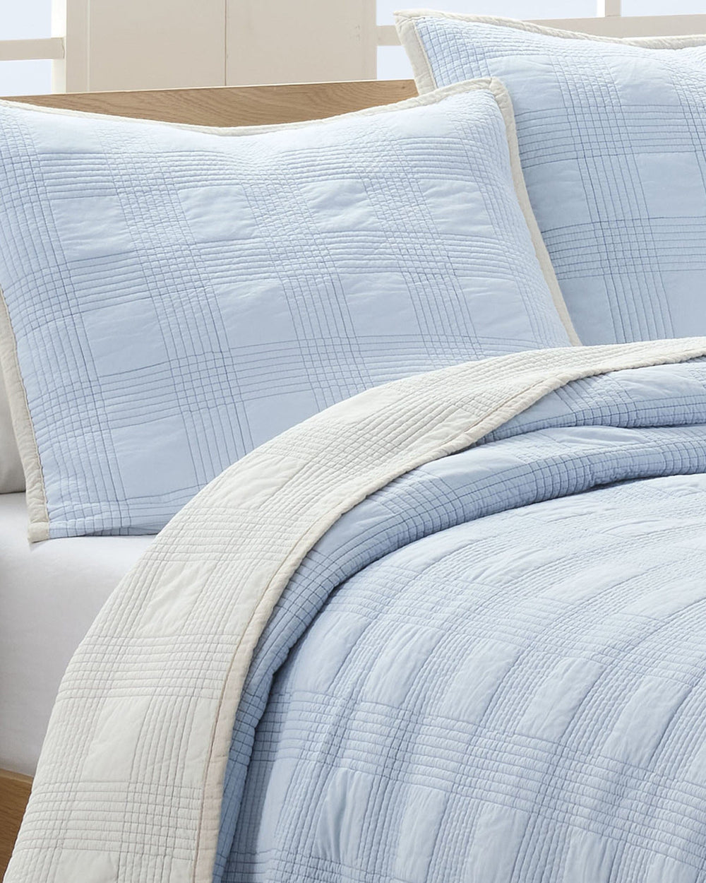 The front view of the Southern Tide Camden Euro Sham by Southern Tide - Ivory/Blue