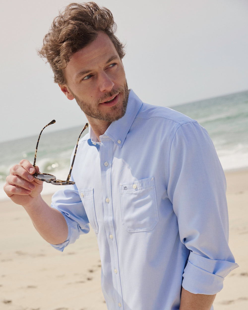 The lifestyle view of the Southern Tide Dock Shirt by Southern Tide - Cerulean