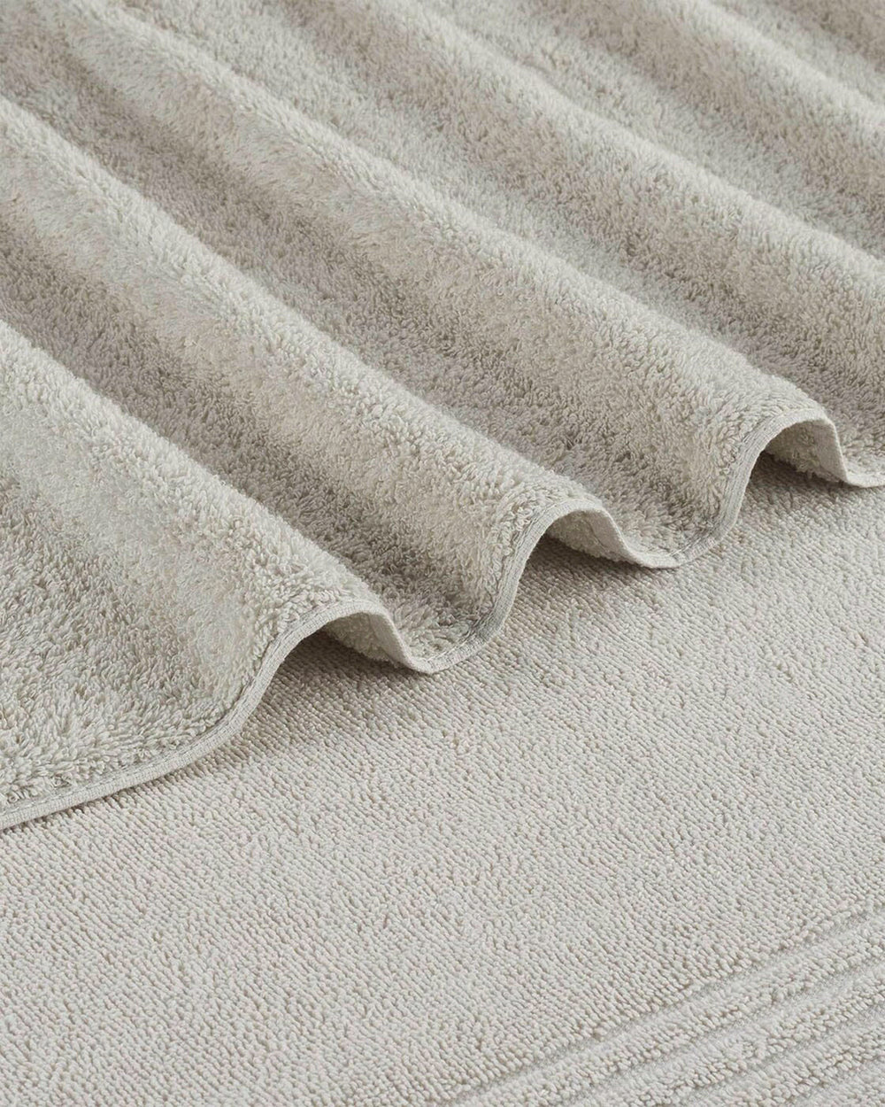 The detail view of the Southern Tide Performance Oversized Bath Towel by Southern Tide - Harpoon Grey