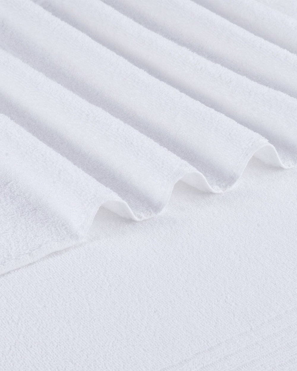 The detail view of the Southern Tide Performance Oversized Bath Towel by Southern Tide - Optical White