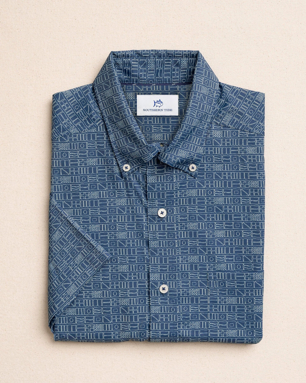 The front view of the Southern Tide ST Nautical Flags Coastal Breeze® Short Sleeve Sport Shirt by Southern Tide - Nautical Blue