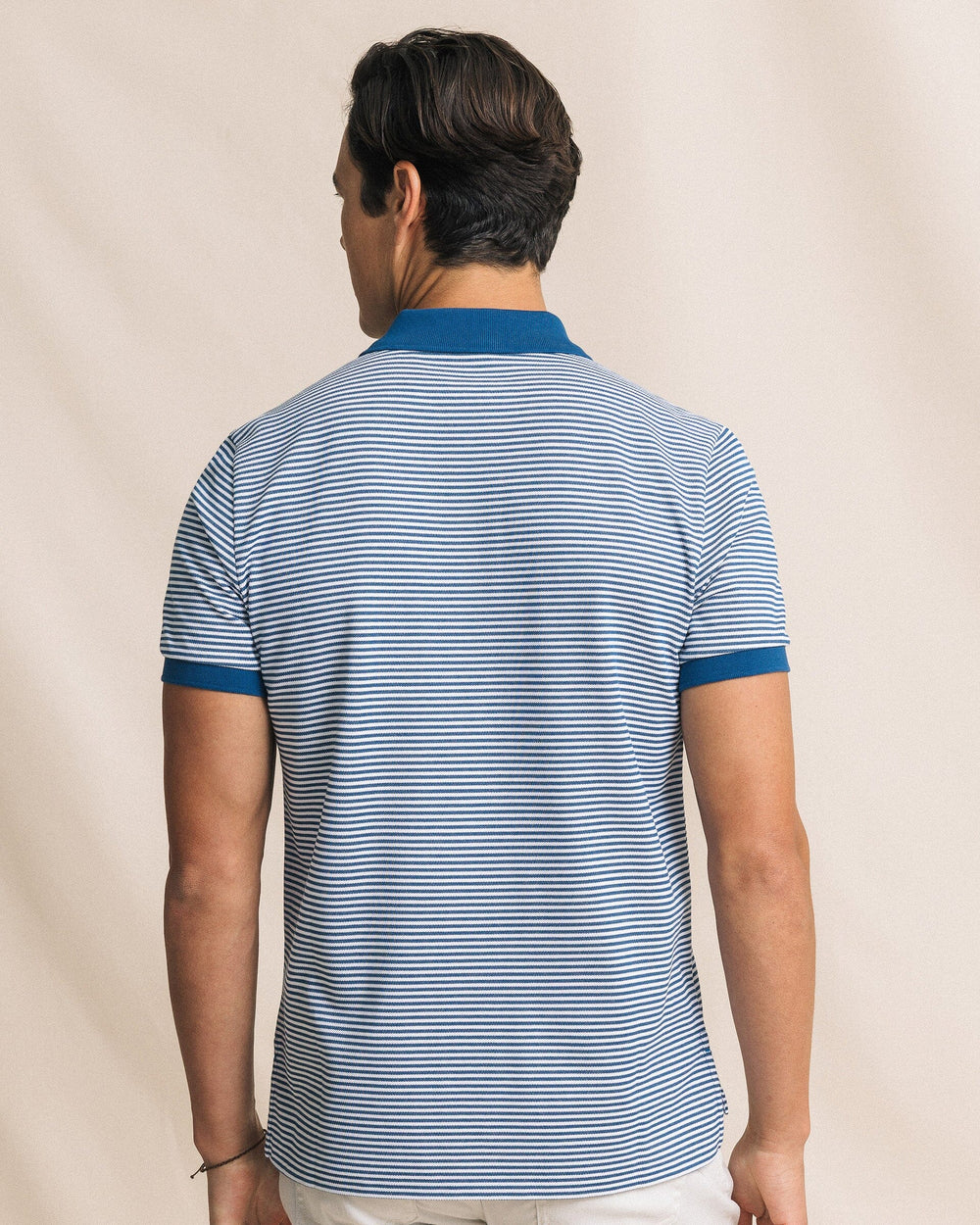 The back view of the Southern Tide Striped Skipjack Polo by Southern Tide - Nautical Blue