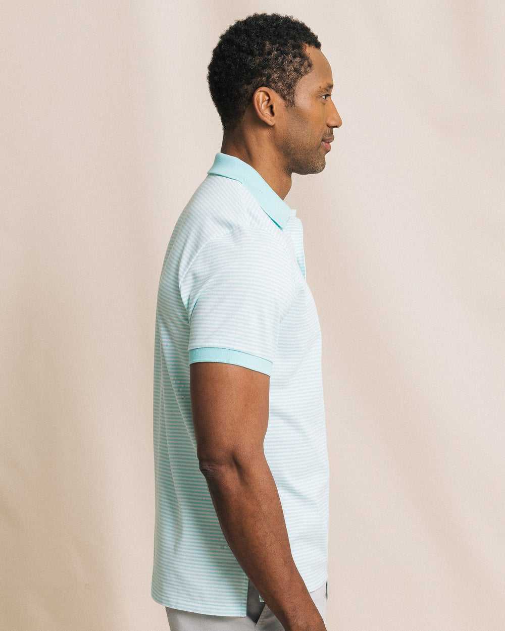 The side view of the Southern Tide Striped Skipjack Polo by Southern Tide - Shore Blue