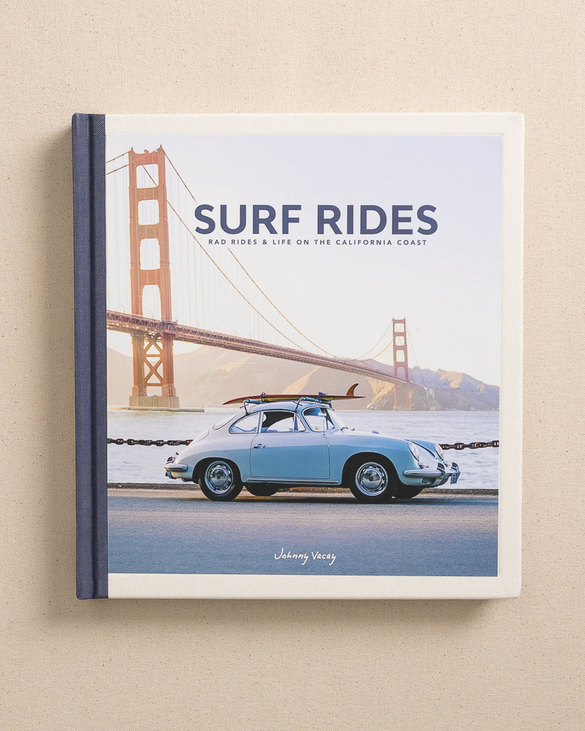 The front view of the Johnny Vacay Surf Rides Coffee Table Book at Southern Tide - White
