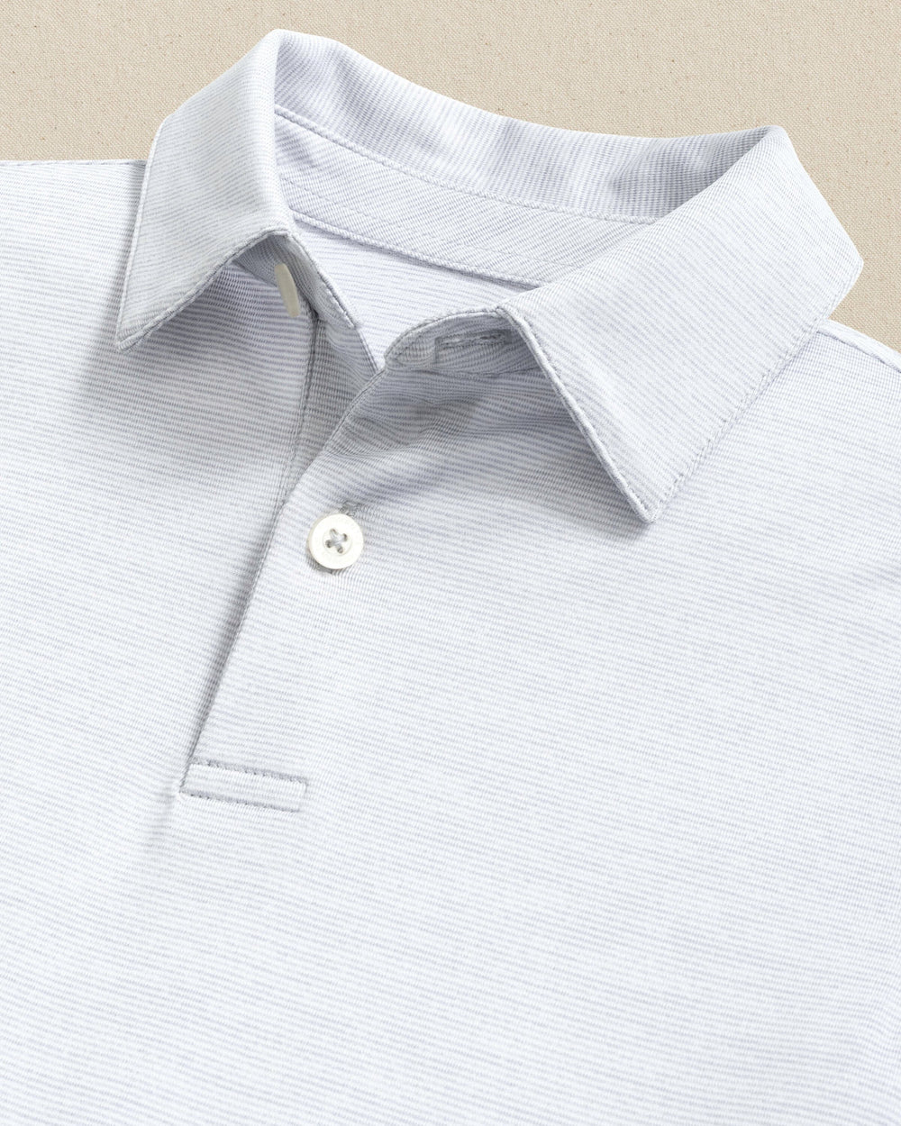 The detail view of the Southern Tide Boy's Driver Spacedye Polo Shirt by Southern Tide - Slate Grey