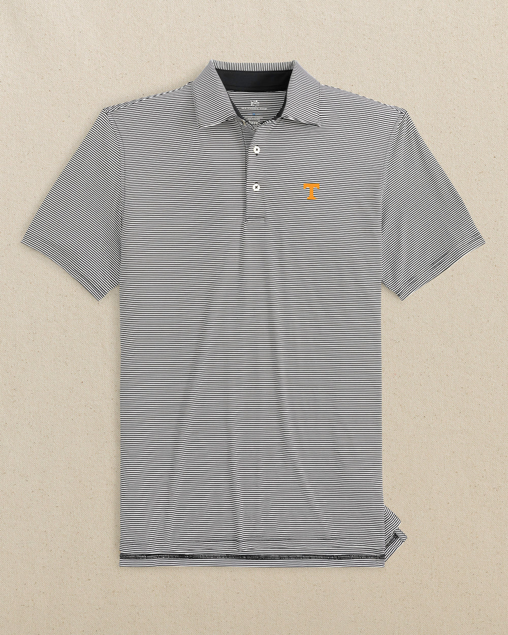 The front view of the Southern Tide Tennessee Vols brrr°®-eeze Meadowbrook Stripe Polo by Southern Tide - Caviar Black
