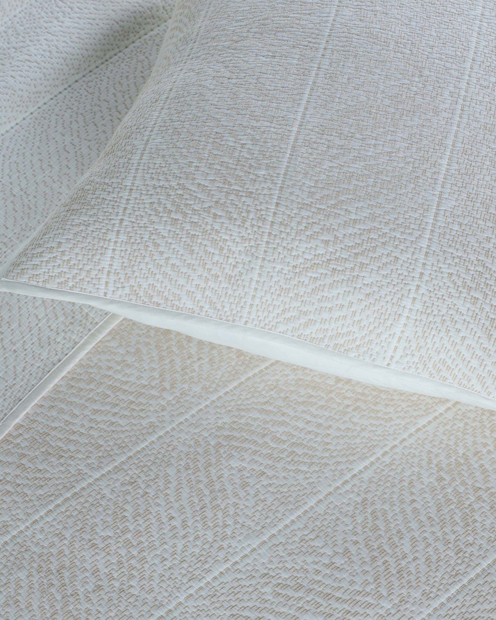 The detail view of the Southern Tide Tideline Coverlet Sham by Southern Tide - White Sand 