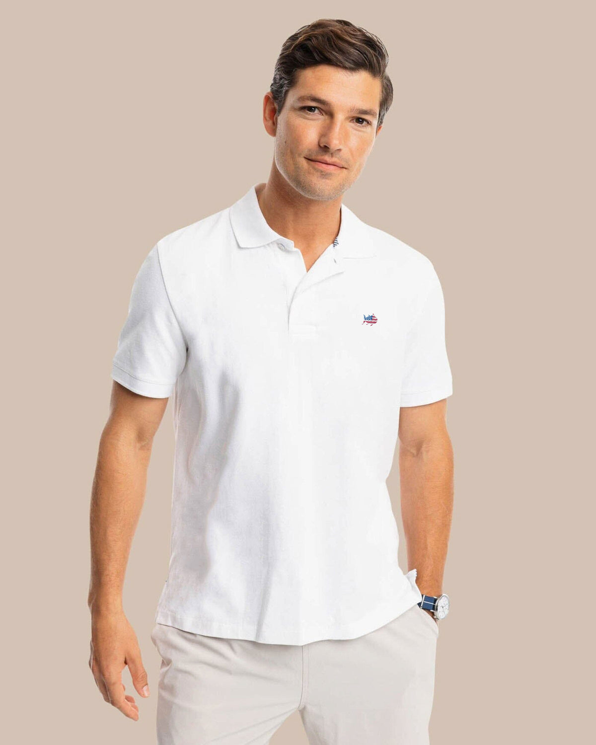 The front view of the Southern Tide USA Flag Skipjack Polo by Southern Tide - Classic White
