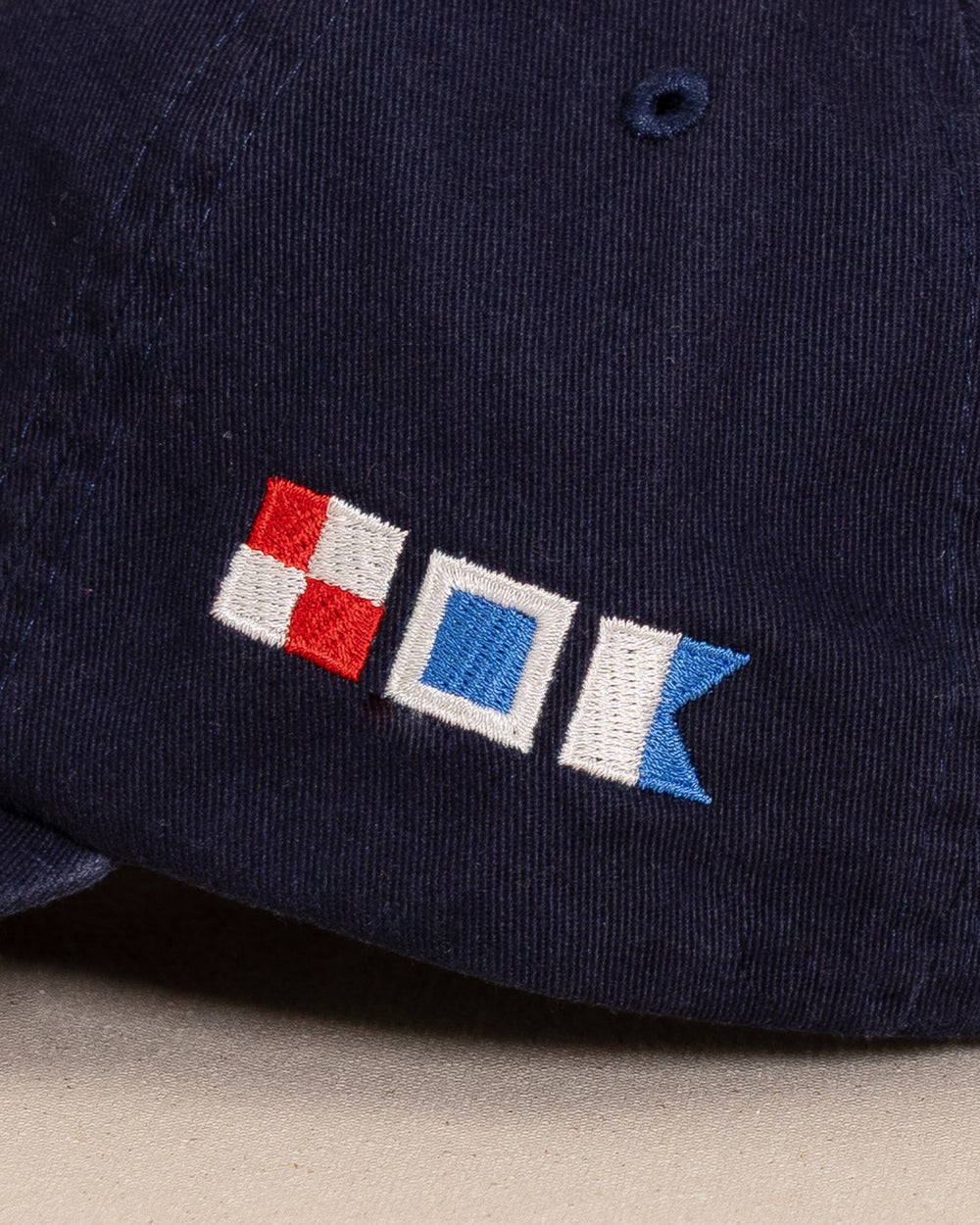 The detail view of the Southern Tide USA Nautical Flags Skipjack Hat by Southern Tide - Navy