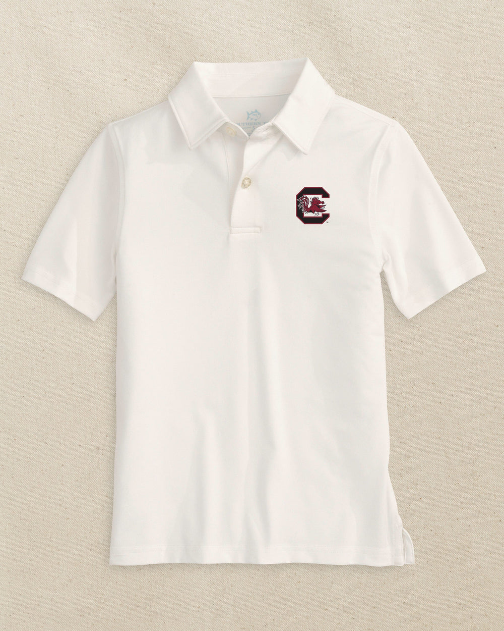 The front view of the Southern Tide USC Gamecocks Boys Driver Polo Shirt by Southern Tide - Classic White