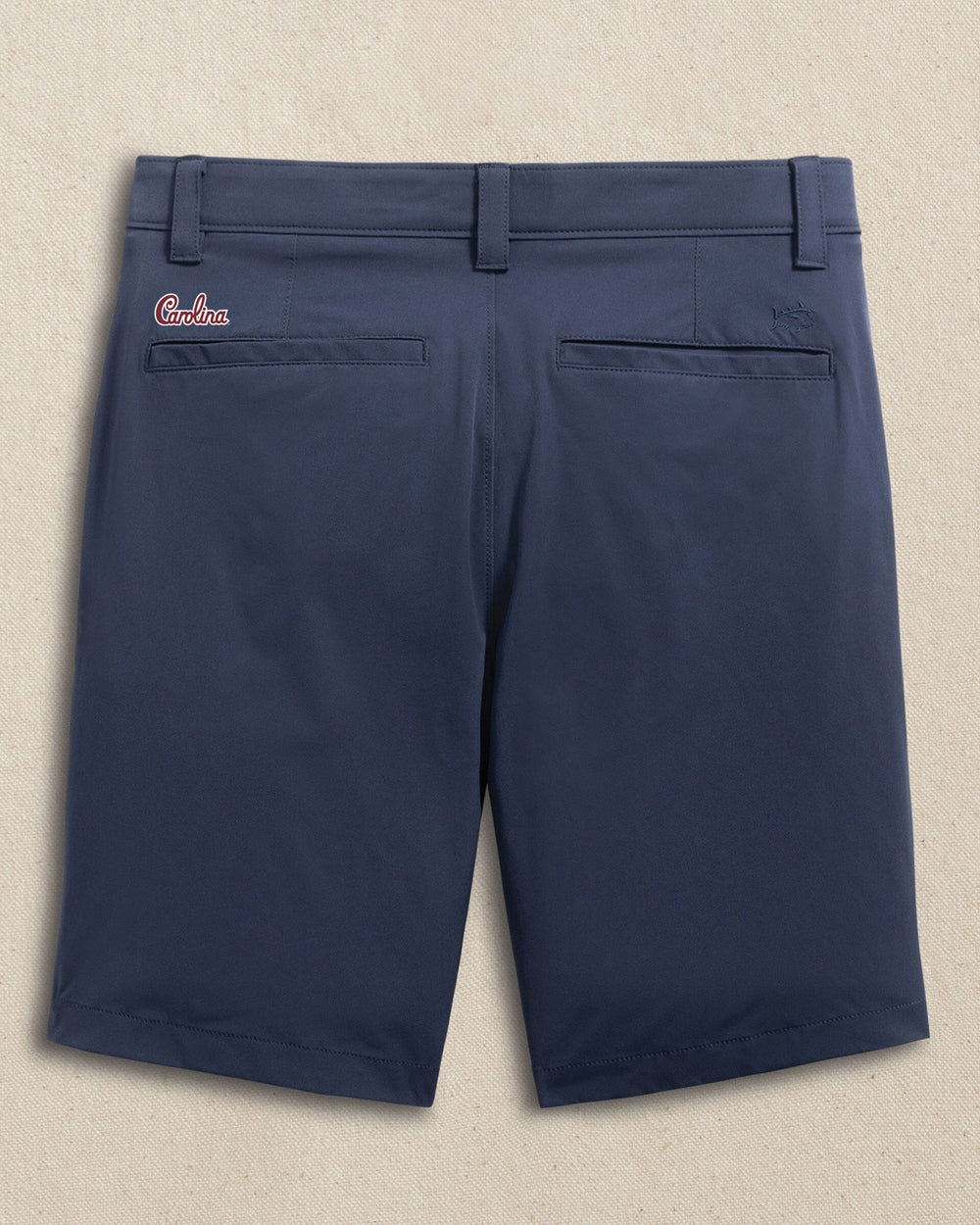 The back view of the Southern Tide USC Gamecocks Carolina Script brrr°®-die 8" Performance Short by Southern Tide - True Navy
